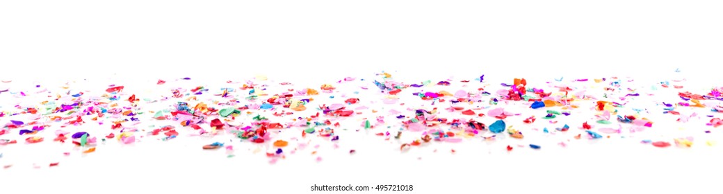 Colorful Confetti In Front Of A White Background