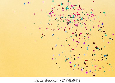 Colorful of confetti on gold background. Brilliant colored sequins. Holiday greeting card. Happy holidays. Minimal, flat lay, copy space. Mockup - Powered by Shutterstock