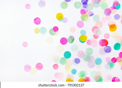 Colorful Confetti On White Background With Copy Space