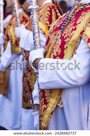 Colorful costumes of the Acolyte Corps in an Andalusian Holy Week procession.