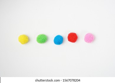 Colorful cotton balls for Montessori called Pom pom ball - Isolated white background