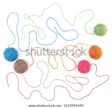 Colorful cotton thread balls isolated on white background. Set of five color (orange, pink, grey, green, blue) thread balls.
