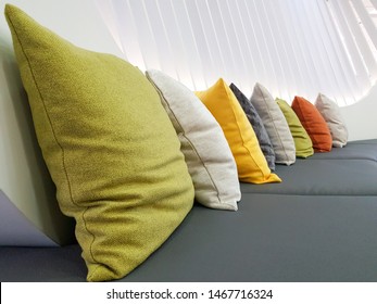 Colorful Couch Pillow Decoration On Grey Sofa.