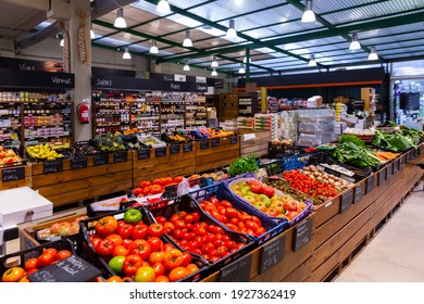 Colorful Counter With Large Assortment Of Fresh Fruits And Vegetables For Sale In Eco Products Store