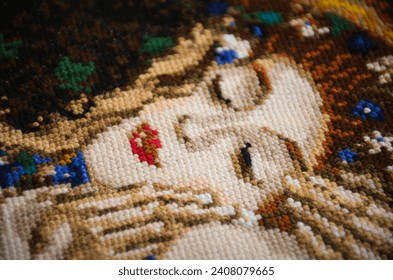 Colorful cross stitch art inspired by Gustav Klimt's painting The Kiss