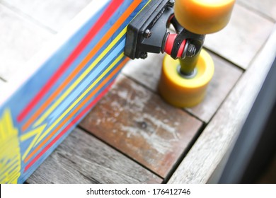 Colorful Cruiser Skate Board With Yellow Wheels Top View