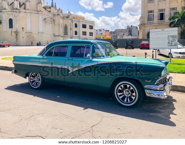 Colorful Cuban\
vintage car. American classic car on the main road in Havana Cuba. \
A symbol of Old Havana\
10/02/2018