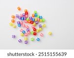 Colorful cube-shaped beads with letters for making necklaces and bracelets