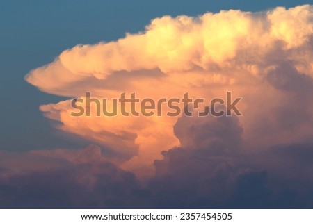 Colorful cumulonimbus cloud at sunset