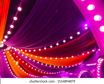 Colorful curtain and light bulb decorations. Circus party decorations. - Shutterstock ID 1514894879