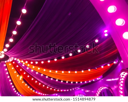 Colorful curtain and light bulb decorations. Circus party decorations.