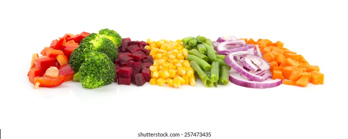 Colorful Cut Vegetables In A Line With Perspective Isolated On White Background