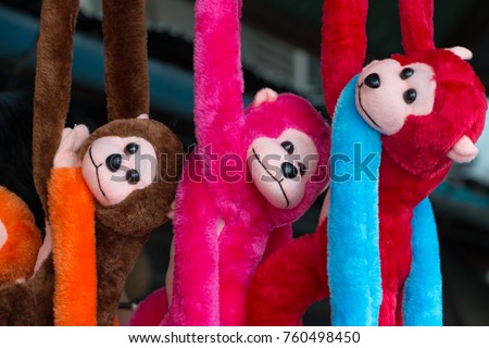 Colorful cute little monkey dolls.