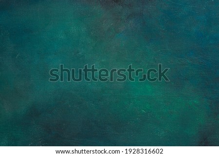 Colorful dark blue-green painted wooden board. Abstract background.  Flat lay.