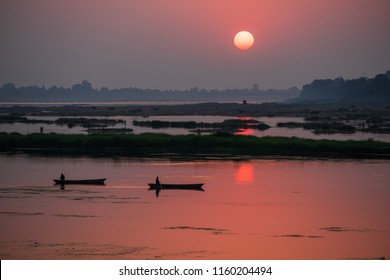 A colorful dawn over the river Narmada with sunrise at Cheepaner Ghat, Madhya Pradesh, India.