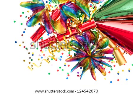 colorful decoration with garlands, streamer, cracker, party hats and confetti. festive background