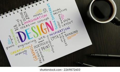 Colorful DESIGN word cloud handwritten in notebook with espresso and pens on black wooden desk - Shutterstock ID 2269872603