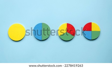 Colorful different shape of wooden pie chart pieces.