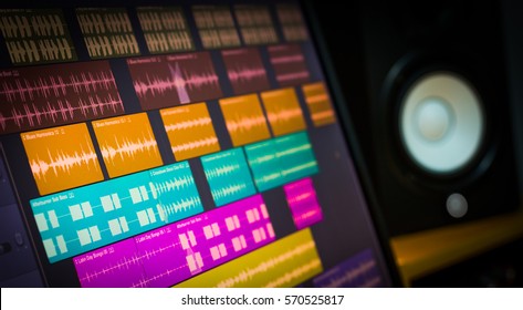 Colorful Digital Waveform On Computer Monitor And Studio Speakers For Sound Recording Concept