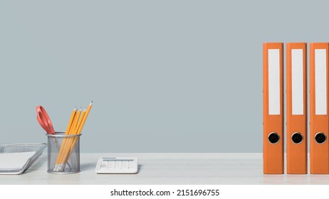 Colorful document binders or lever arch file on a shelf or desk banner - Powered by Shutterstock