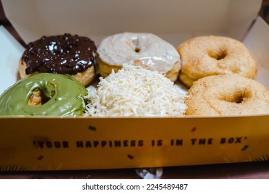 Colorful donuts box ready for party - Shutterstock ID 2245489487