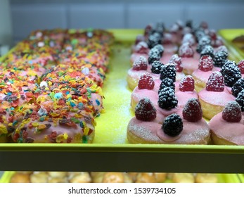 Colorful Donuts In Display Case