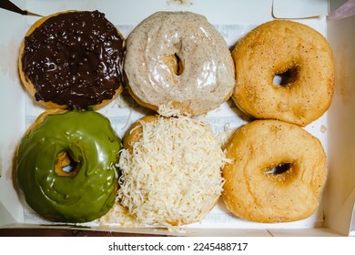 Colorful donuts in the paper box. Top view or flat lay. - Shutterstock ID 2245488717