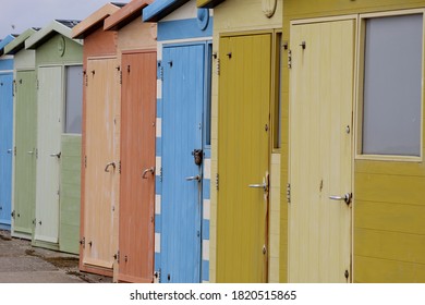 Colorful Doors Lined Up On A Cloudy Beach Day 