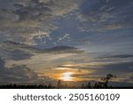 Colorful dramatic sky with cloud at sunset.