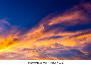 colorful dramatic sky with cloud at sunset.