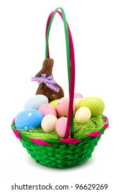 Colorful Easter Basket With Eggs, Candy And Chocolate Bunny