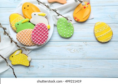 Colorful easter cookies on blue wooden background