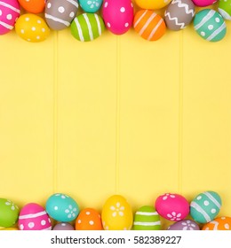 Colorful Easter Egg Double Border Against A Yellow Wood Background