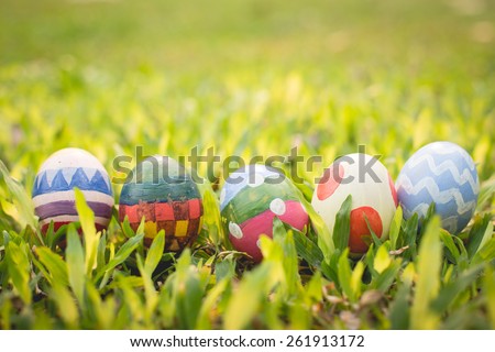 colorful Easter egg in the fresh spring meadow.