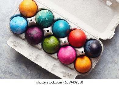 Colorful Easter eggs in egg box. Painted Easter eggs in an egg carton, close up. - Powered by Shutterstock