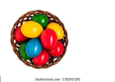 Colorful Easter Eggs In Nest Basket Isolated On White Background. Top View.