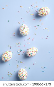 Colorful easter eggs on pastel blue background. Flat lay composition, view from above. - Shutterstock ID 1906667173