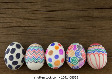 Colorful Easter Eggs On Wooden Background