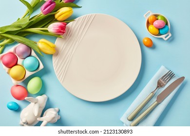 Colorful Easter Eggs and White Plate