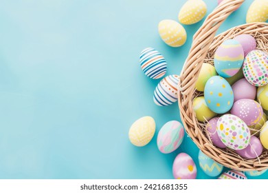 Colorful Easter Eggs in a Wicker Basket on Pastel Blue Background - Powered by Shutterstock