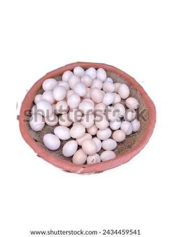 Colorful egg in basket isolated on white background. Easter eggs are commonly found during the season of Eastertide for Ramadan day of Islam.