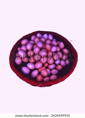 Colorful egg in basket isolated on white background. Easter eggs are commonly found during the season of Eastertide for 