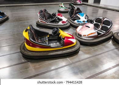 Colorful electric bumper car in autodrom in the fairground attractions at amusement park.