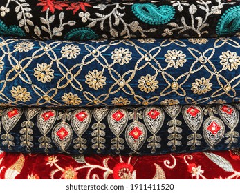 Colorful Embroidered Clothing Piled Up