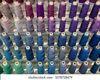 Colorful embroidery thread spool using in garment industry  row multicolored yarn rolls  sewing material selling in the market