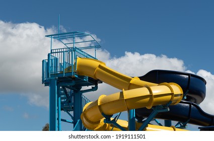 Colorful Empty Water Park Twisted Water Slide Amusement Resort For Children And Family Vacations On A Tropical Day