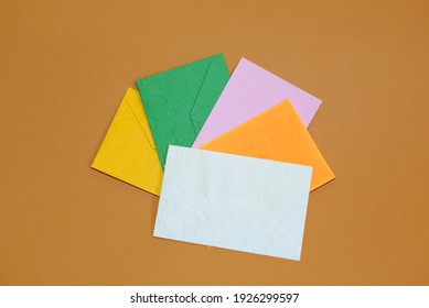 Colorful Envelopes On A Paper Background.