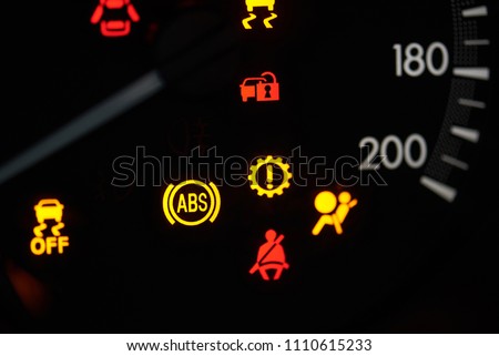 Colorful error sign on car dashboard close up view