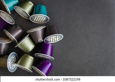 Colorful Espresso Coffee Capsules Used On Black Background, Recycling, Environment.