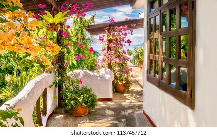 Colorful exterior view of a seaside hotel balcony, with Mediterranean style white walls and vibrant bougainvillea flowers. Philippines.